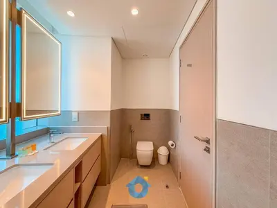 a bathroom with a sink and a toilet and a shower at Best Burj Khalifa Skyline View Huge 3BR Like Home in Dubai