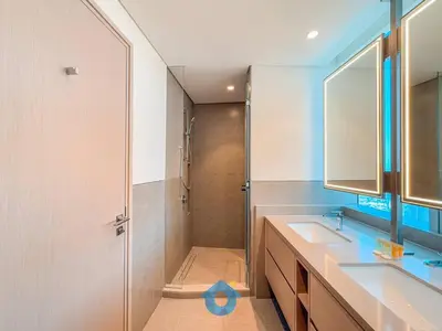 a bathroom with two sinks and a shower at Best Burj Khalifa Skyline View Huge 3BR Like Home in Dubai