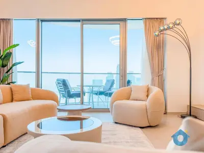 a living room with two couches and a table and chairs at Best Burj Khalifa Skyline View Huge 3BR Like Home in Dubai