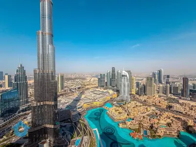 an aerial view of a city with a tall skyscraper at Direct Burj Khalifa View Near Dubai Mall Like Home in Dubai