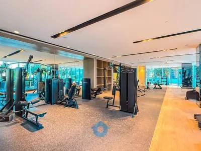 a gym with treadmills and exercise equipment in a building at Direct Burj Khalifa View Near Dubai Mall Like Home in Dubai