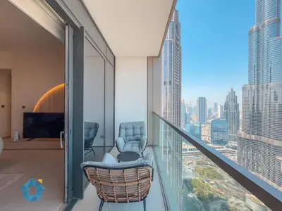 an office with a balcony with a view of a city at Direct Burj Khalifa View Near Dubai Mall Like Home in Dubai