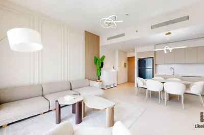 a living room with a couch and a table at LUXURY AND BEST LOCATION 2 MINUTES BURJ KHALIFA in Dubai