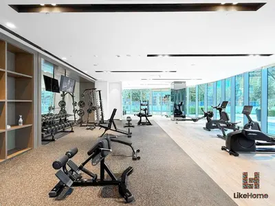 a gym with treadmills and exercise equipment in a building at LUXURY AND BEST LOCATION 2 MINUTES BURJ KHALIFA in Dubai