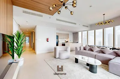 a living room with a couch and a table at Exclusive Burj Khalifa View 3BR SkyManson LikeHome in Dubai