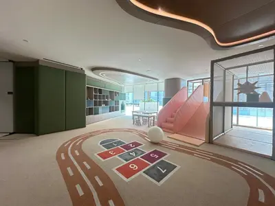 a large room with a carpet on the floor at Luxury 1BR - Private Balcony Pool & Smart Home - Binghatti Phantom JVC in Dubai