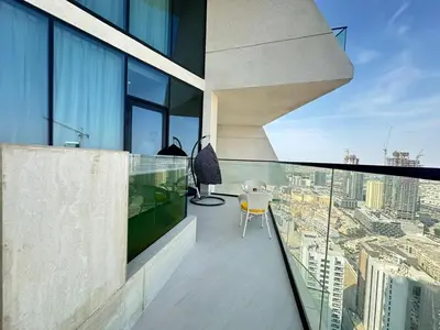 an apartment balcony with a view of a city at Luxury 1BR - Private Balcony Pool & Smart Home - Binghatti Phantom JVC in Dubai