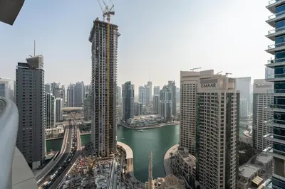a view of a city with buildings and a river at Gala Guests - Signature Skyview Tower High-Floor Marina Living in Dubai