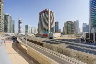 a highway in a large city with tall buildings at Aspin Stylish Burj Views Studio-City View in Dubai