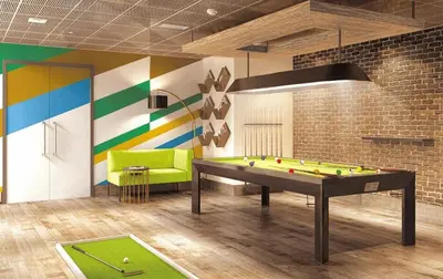 a room with a pool table and a couch at Imperial Avenue Downtown Lux 1Bed with Balcony in Dubai