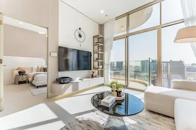 a living room with a couch and a tv at Community View, Near the Circle Mall, Pear House II by Imtiaz, Jumeirah Village Circle by Deluxe Holiday Homes in Dubai