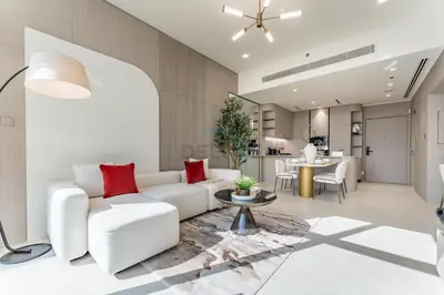 a living room with a white couch and red pillows at Community View, Near the Circle Mall, Pear House II by Imtiaz, Jumeirah Village Circle by Deluxe Holiday Homes in Dubai