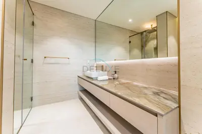 a bathroom with a sink and a glass shower at Community View, Near the Circle Mall, Pear House II by Imtiaz, Jumeirah Village Circle by Deluxe Holiday Homes in Dubai