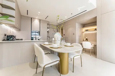 a kitchen and dining room with a table and chairs at Community View, Near the Circle Mall, Pear House II by Imtiaz, Jumeirah Village Circle by Deluxe Holiday Homes in Dubai