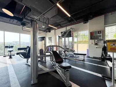 a gym with treadmills and cardio equipment in a building at Chic & Modern 1BR Stay in Collective Dubai Hills in Dubai