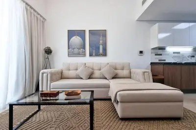 a living room with a couch and a coffee table at Modern Stay in Azizi Samia1BR Al Furjan in Dubai