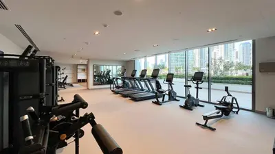 a gym with a bunch of treadmills and machines at Luxury 2BR Burj Crown Stay Downtown in Dubai