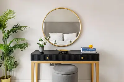 a dressing table with a mirror and a stool at BLVD-Beachfront Luxe Stay with Private Beach Access in Dubai