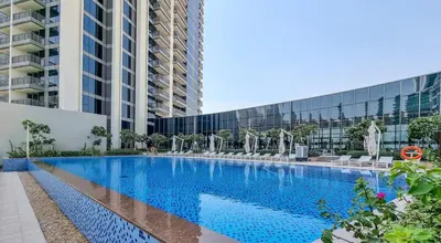 a large swimming pool in front of a building at Luxury Bluewater Escape 1BR Canal view 5242T in Dubai