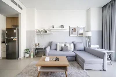 a living room with a couch and a table at Luxury Bluewater Escape 1BR Canal view 5242T in Dubai