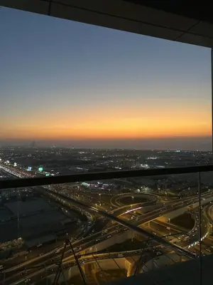 a view of a highway at night from the top of a building at Luxury Studio With Pool View Near Burj Khalifa in Dubai