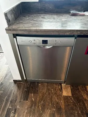 a dishwasher in a kitchen with a counter top at iii in Dubai