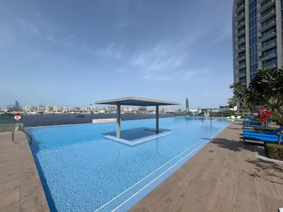 a large swimming pool with a pavilion on top of it at The Grand Majestic Sky Luxe 1BR Sleeps 4 06 in Dubai