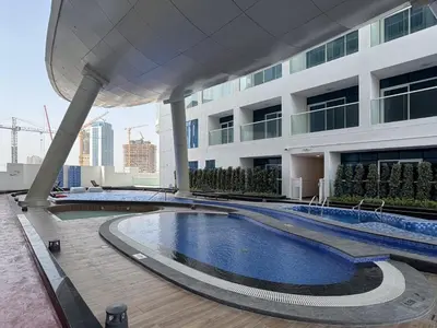 a swimming pool on the roof of a building at Opalz Reverie Luxe Studio Escape 08 in Dubai
