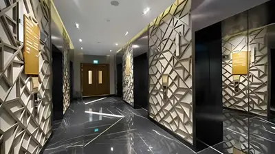 a hallway with black and gold walls and a hallway with a door at Modern Luxury Stylish 2BR Near Downtown Aykon C in Dubai