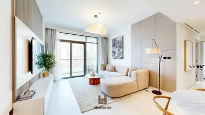 a living room with a couch and a tv at Chic 2BR Getaway Marina Vista T2 Sea view in Dubai