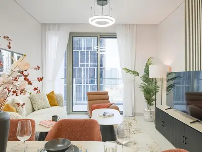 a living room with a couch and a table at Vida Residences 2BR-Direct Dubai Mall Access in Dubai