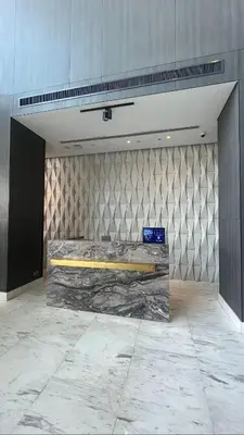 a room with a large bed in a wall at Vogue JVT Novotel near Springs Souk Mall, Studio Apartment with Balcony and City View, Access to all Amenities in Dubai