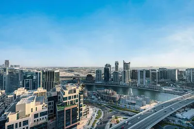 an aerial view of a city with a river and buildings at Luxury Studio Retreat! Heart of Downtown Dubai! in Sabkhah