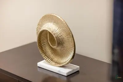 a straw hat sitting on top of a table at Luxury Studio Retreat! Heart of Downtown Dubai! in Sabkhah