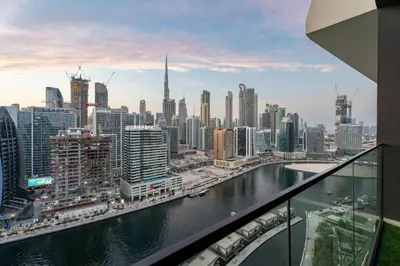 a view of a city with a river and buildings at GuestReady - Studio l Partial Burj Khalifa View in Dubai