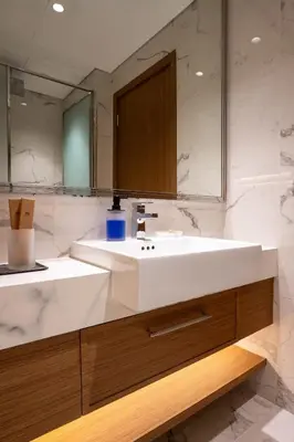 a bathroom with a white sink and a mirror at Airstay - Stylish Studio - Spacious Balcony - Monthly Offer Available! in Dubai