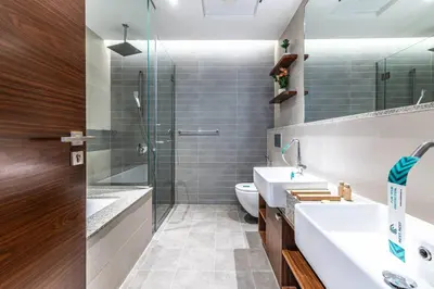 a bathroom with a shower and a sink and a toilet at Cozy 2BR Near Zabeel Park - Dubai frame view in Dubai
