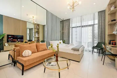 a large living room with a bed and a couch at New Stylish Apartment, Metro 5min walk, Dubai Marina 20min in Dubai