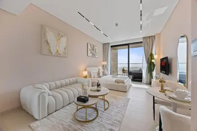 a living room with a couch and a table at Private Jacuzzi Canal view - Near Burj Khalifa in Dubai