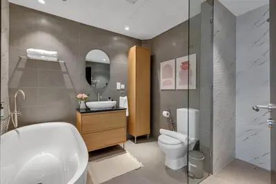 a bathroom with a toilet and a sink at The Torch Cozy 1BR Marina Near JBR & Metro in Dubai