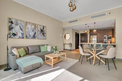 a living room with a couch and a table at The Torch Cozy 1BR Marina Near JBR & Metro in Dubai