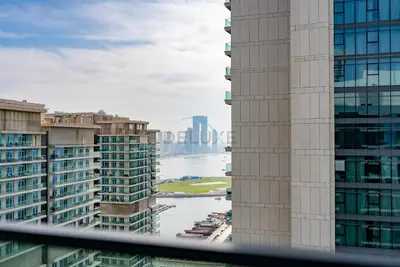 a view of a river between two tall buildings at Stunning View, Easy Access to Dubai Attraction, Beach Vista Tower 2, Emaar Beachfront by Deluxe Holiday Homes in Dubai