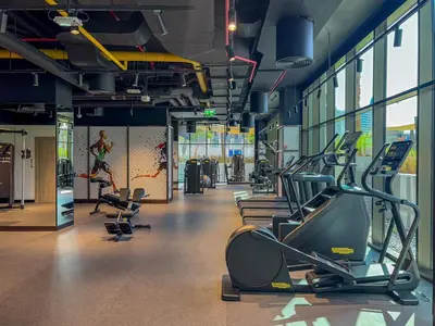 a gym with cardio equipment in a building at Luxury 1Bed with Canal Views Near Burj Khalifa in Dubai