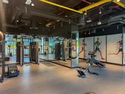 a gym with several treadmills and exercise equipment at Luxury 1Bed with Canal Views Near Burj Khalifa in Dubai