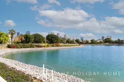 a river with a city in the background at LUX The Serene Springs Villa in Dubai
