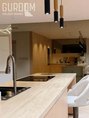 a kitchen with a sink and a counter top at Amazing 4 BR on Palm Jumeirah with super sea view in Dubai