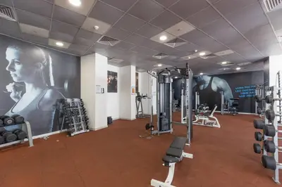 a gym with several treadmills and machines at Vacationer l Cozy 1 Bed l Partial Sea View l Prime Location in Dubai