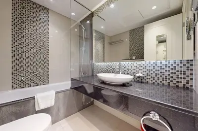 a bathroom with a sink and a mirror at Vacationer I Premium 2 Bedroom Apartment I Iconic Burj Khalifa View I Downtown I Distinction Tower in Dubai