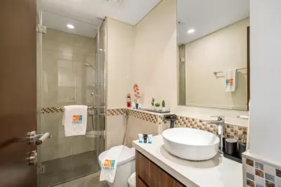 a bathroom with a sink and a shower at Stylish 1BR Burj Khalifa Fireworks View - Reva Residence in Dubai