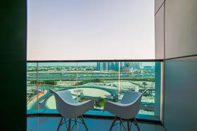 a view from the top of a building with two chairs at Balcony Breeze O2 with amazing high way view in Dubai